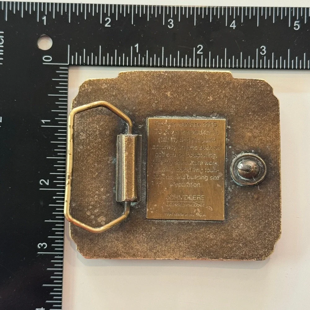 John Deere vintage brass